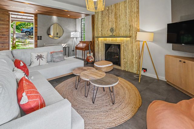 Cosy lounge area with sofa and fireplace